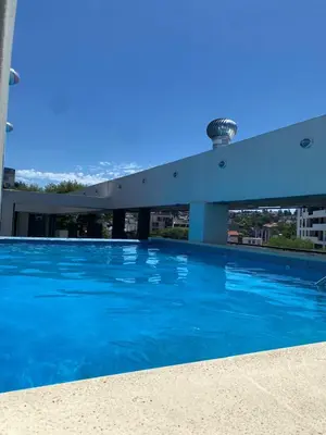 a swimming pool on the roof of a building at dto 22 TEMPO in Villa Carlos Paz