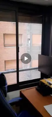 a window in an office with a view of a building at Depto Lanin 5 in Cordoba
