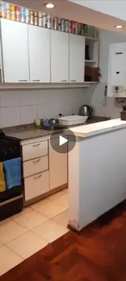 a kitchen with white cabinets and a counter top at Depto Lanin 5 in Cordoba