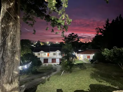 a view of a house at night at Departamentos Elisabeth in Tanti