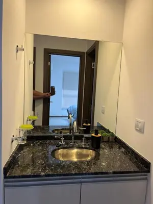 a bathroom counter with a sink and a mirror at Departamento centrico en carlos paz in Villa Carlos Paz