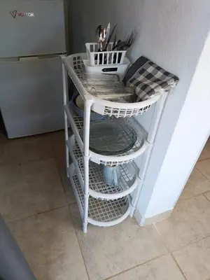 a white shelf in the corner of a kitchen at Aves Del Monte in Santa Rosa de Calamuchita