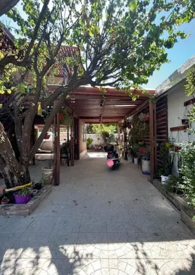 a pavilion with a scooter parked under it at Departamento de 2 a 5 personas in Villa Carlos Paz