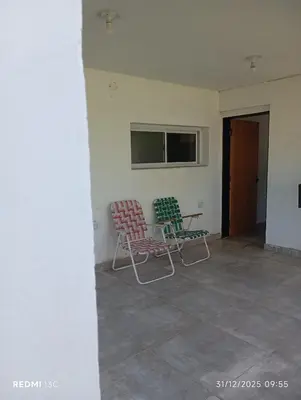 two chairs and a table in a room at La Cautivadora Potrero de Garay in Potrero de Garay