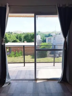 an open door to a balcony with a view at La Cautivadora Potrero de Garay in Potrero de Garay