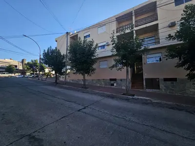 an empty street in front of a building at 165saavedra in Villa Carlos Paz