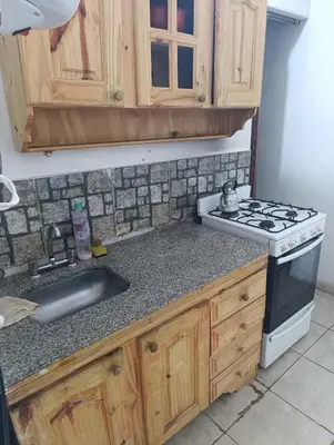 a kitchen with a stove and a sink at Soles in Cordoba