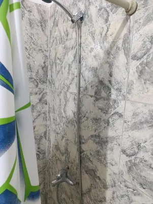 a shower in a bathroom with a shower head at Soles in Cordoba