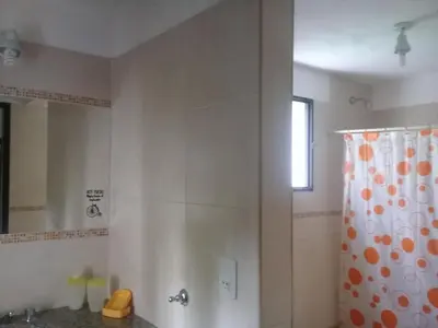 a bathroom with a shower and a shower curtain at Arcadia in Merlo