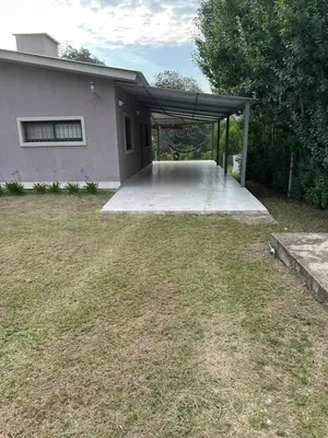 a garage in front of a house at Casita de los Reartes in Los Reartes