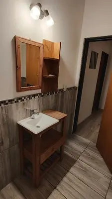 a bathroom with a sink and a mirror at Complejo MAS vista in San Antonio de Arredondo