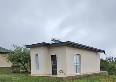 a small house with a solarvisor on top of it at Complejo MAS vista in San Antonio de Arredondo