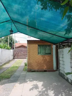 a house with a blue cover over it at Don Nene in Villa Cura Brochero