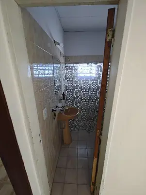 a small bathroom with a sink and a shower at Casa Villa Carlos Paz in Villa Carlos Paz