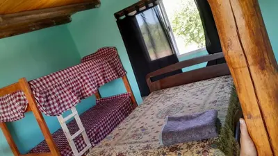 a bedroom with a bed and a window at Cabaña AGUSTIN in Amboy