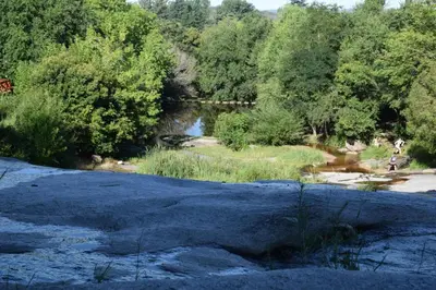 a body of water with trees and a river at Kairós in Tanti