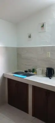 a kitchen with a sink and a counter top at Hostel El Chinchero in Merlo