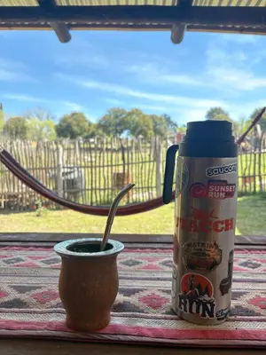 a cup of coffee and a can of coffee on a table at Casitas Del Champaqui in Villa Yacanto