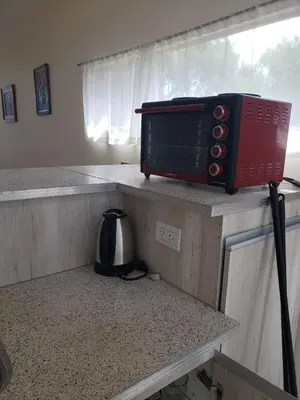 a microwave sitting on a counter in a kitchen at Miradores del Dique in San Francisco del Monte de Oro