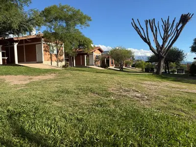 an empty yard in front of a house at Cabañas AdamiS 5 in Villa Cura Brochero
