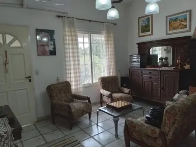 a living room with a couch and chairs and a table at La Nora in Cuesta Blanca
