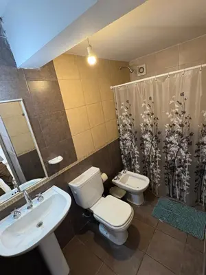 a bathroom with a toilet and a sink at Cañada 12 depto 1 dormitorio pax 3 in Cordoba