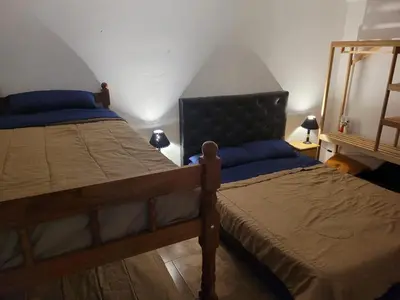 a bedroom with two twin beds in a room at Mate host in Cordoba
