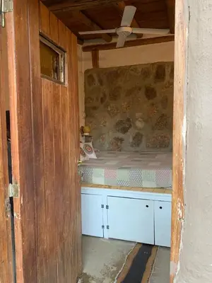 a small room with a bed in a house at El Jopi in Tanti