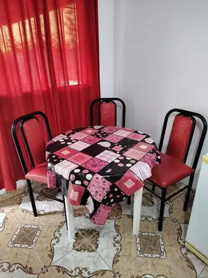 a table and two chairs with a quilt on it at Lo de Alicia in Santa Rosa de Calamuchita