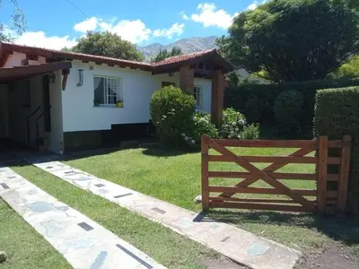 a house with a wooden gate in front of a yard at Valle de Bendición in El Rincón