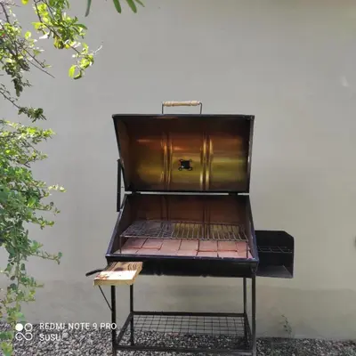 a bench sitting in front of a wall at Casa El ALto 1 in Villa General Belgrano