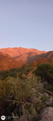 a view of a mountain with trees and rocks at Puesto Kupuka in Villa de Las Rosas