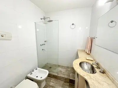 a bathroom with a sink and a toilet at departamento temporal 3 personas in Cordoba