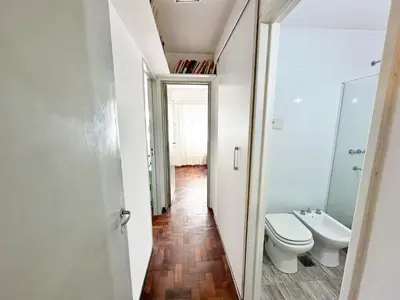 a bathroom with a toilet and a sink at departamento temporal 3 personas in Cordoba