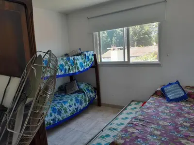 a room with two bunk beds and a window at Fabiana Torres in Villa Carlos Paz