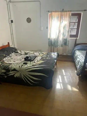 a bedroom with a bed and a window at Bendecida Depto in La Paz