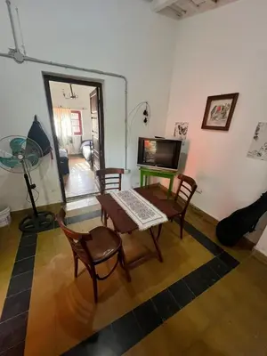 a living room with a table with a computer on it at Bendecida Depto in La Paz