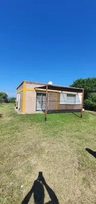 a shadow of a person standing in front of a house at Casa Martina in Villa Rumipal