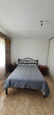 a bedroom with a large bed in a room at Casa Martina in Villa Rumipal