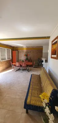 a living room with a couch and a table at Casa Martina in Villa Rumipal