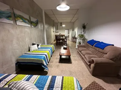 a living room with couches and a couch and a table at Lo de Capretta 2 in Almafuerte