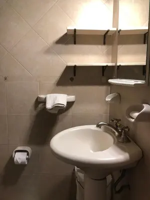 a bathroom with a sink and a mirror at casa vista al lago in Villa Carlos Paz