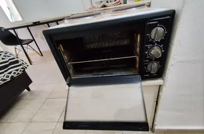a toaster oven sitting on top of a counter at Rondeau Studios Apartaments in Cordoba