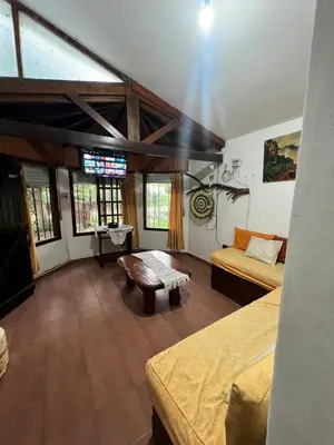 a large room with two beds and a couch at Mar y Sierras in La Paz
