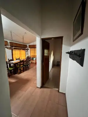 a hallway with a dining room and a dining table at Mar y Sierras in La Paz