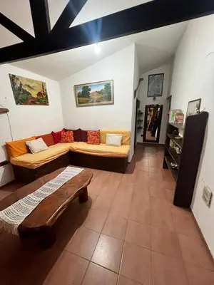 a living room with two couches and a bench at Mar y Sierras in La Paz