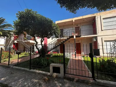 a wrought iron fence in front of a building at Santa Rita Dpto in Villa Carlos Paz