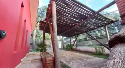 an outside view of a house with a roof at Villa Gesell Diego Sarmiento in Villa Carlos Paz
