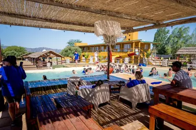a group of people in a swimming pool at Pipperland Hospedaje in Villa García