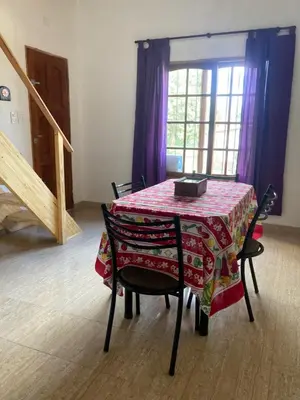 a table with a table cloth on it in a room at Cabañas Onírico - Duplex in Mina Clavero